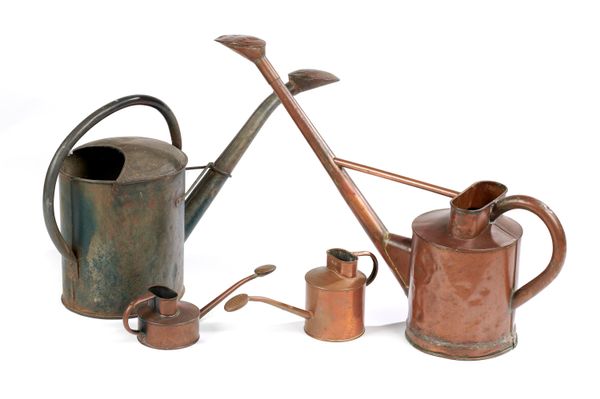 A collection of four watering cans 19th/early 20th century  including one zinc, one copper and two small copper watering cans the largest 79cm...