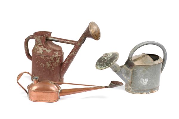 A zinc watering can with copper rose French 19th century with makers stamp 60cm long, together with another painted zinc can with copper rose and a...