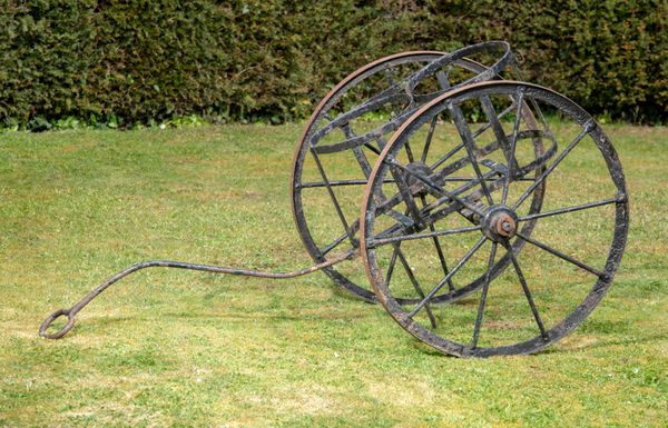 An unusual wrought iron churn cart late 19th century  154cm long