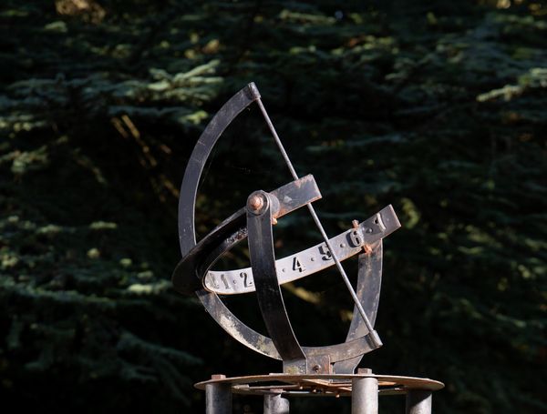A cast iron and copper armillary sundial  1st half 20th century 96cm high by 78cm diameter