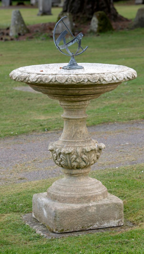 A composition stone bird bath modern the bowl centred with bronze armillary 130cm high by 78cm diameter