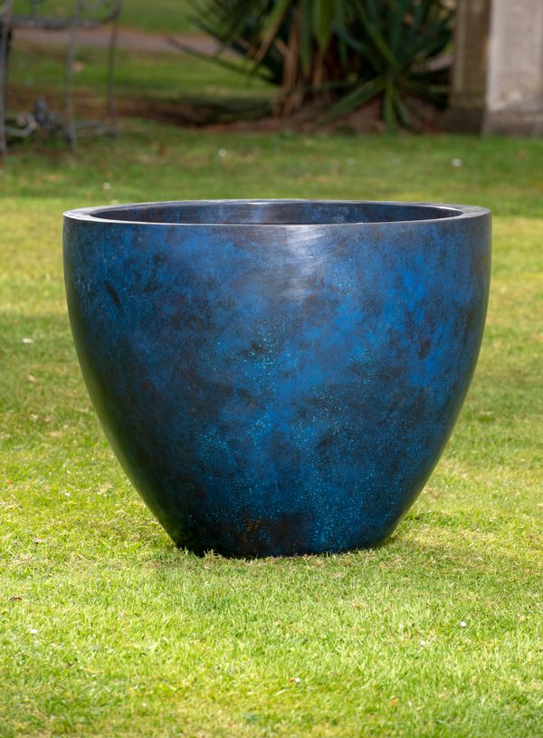 A blue patinated copper planter 59cm high by 70cm diameter