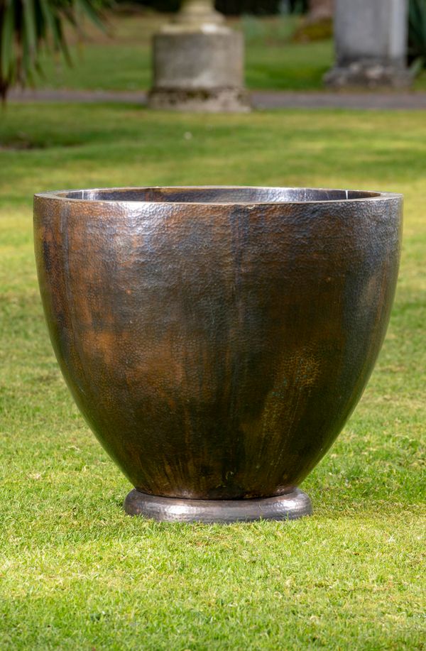 A patinated copper planished planter modern 67cm high by 71cm diameter