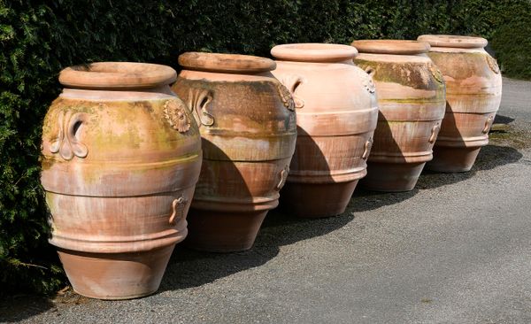 ‡ A set of three terracotta storage jars 2nd half 20th century  each with similar maker‘s plaque 91cm high 