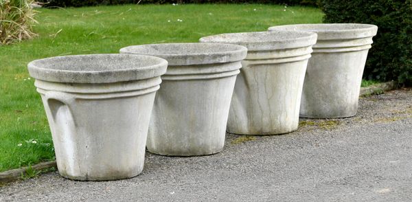 ‡ A set of four composition stone tapering cylindrical planters early 21st century 52cm high by 64cm diameter 