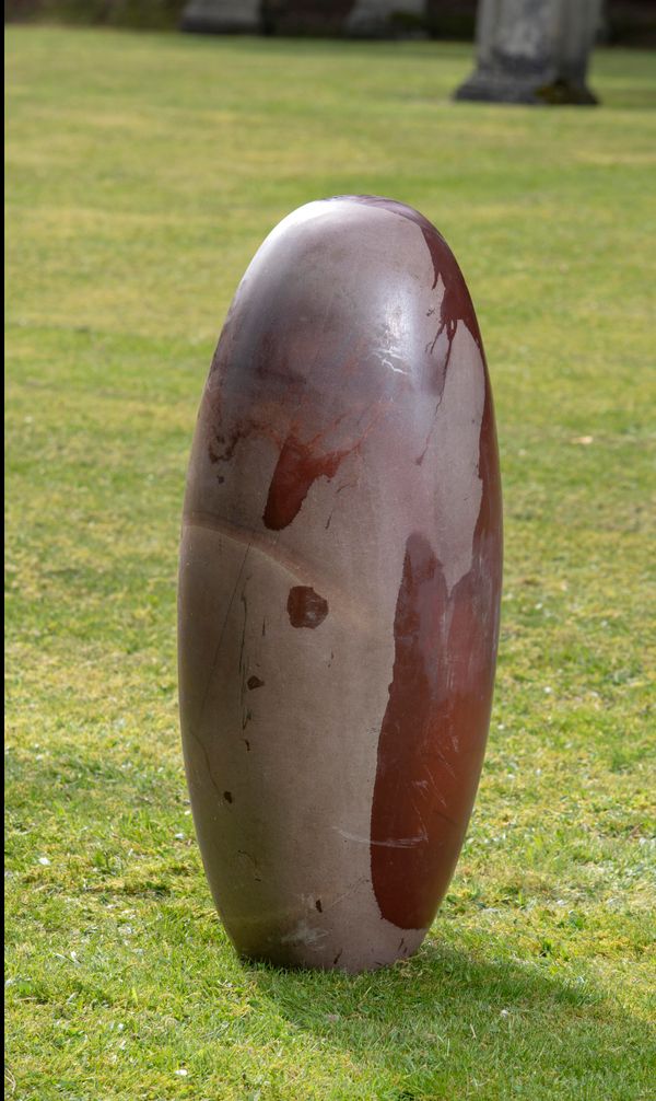 † An exceptionally large Lingum stone 86cm high by 36cm wide Shiva Lingum Stones are so called because in the Hindu religion they symbolise the...