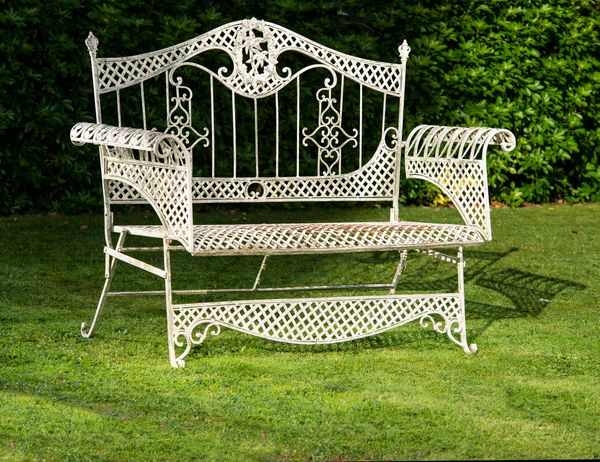 A wrought iron seat French, circa 1900 132cm wide