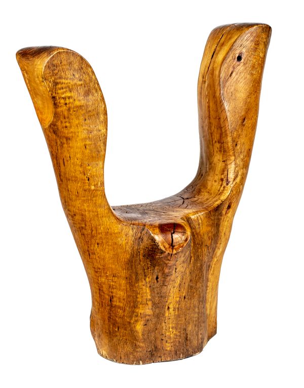 A carved hardwood chair by Adam Birch 115cm high  Adam Birch grew up on a large farm outside Cape Town, South Africa and his love of trees began as...