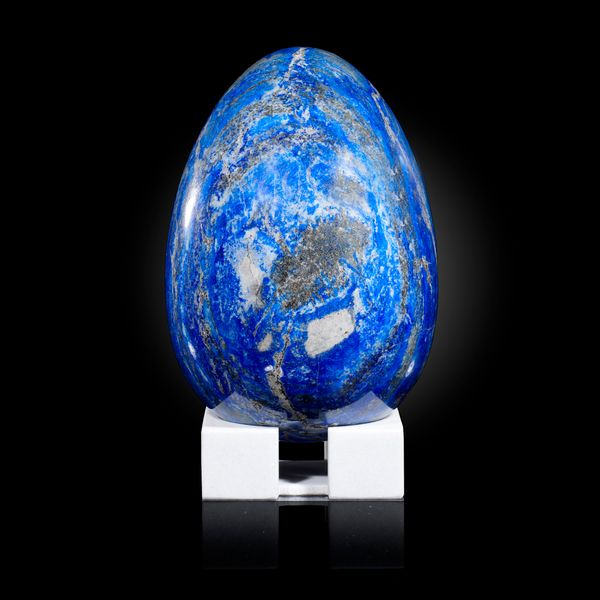 A large lapis lazuli egg on stand Afghanistan  24cm high overall, 6.9kg