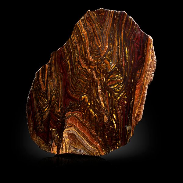 Two Australian mineral slices mookite and tiger iron the largest 39cm 