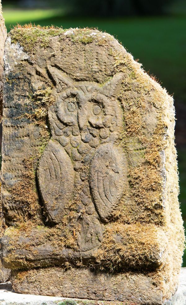 A carved stone relief of an owl 1st half 20th century 44cm high