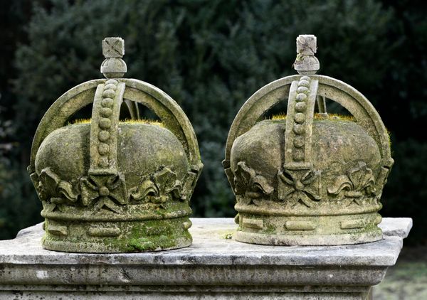 † A pair of carved sandstone crowns modern 42cm high