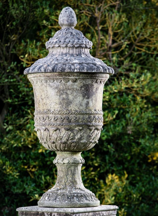 A composition stone lidded urn 2nd half 20th century 140cm high After an original designed by William Kent for Alexander Pope‘s garden at Twickenham