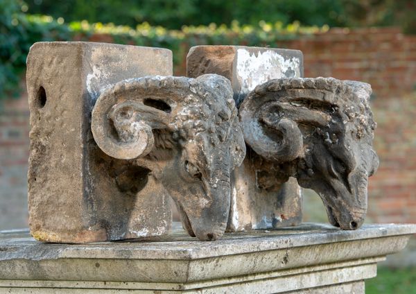 A pair of Victorian carved stone architectural features carved in high relief with rams‘ heads late 19th century 73cm high