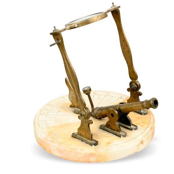 A carved marble and brass noon day cannon sundial modern 20cm diameter