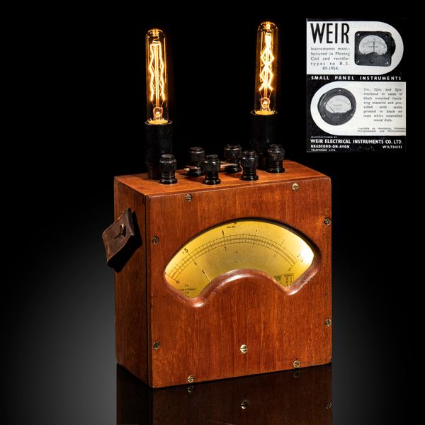 A 1950‘s wood and Bakelite Weir Electrical instrument company Ampmeter now converted to a desk lamp 31cm high by 9cm deep by 18cm wide 