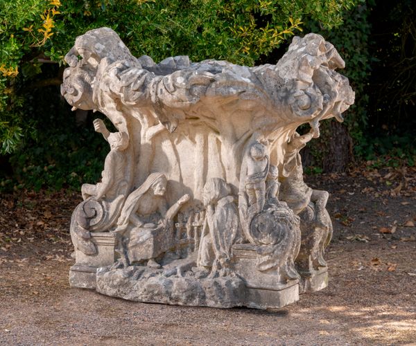 An elaborate and unusual Savonnerie stone planter Northern European, early 20th century 130cm high by 148cm wide