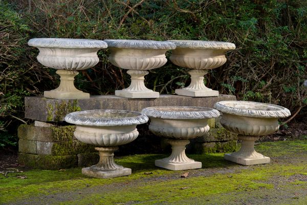 A similar set of composition stone urns  