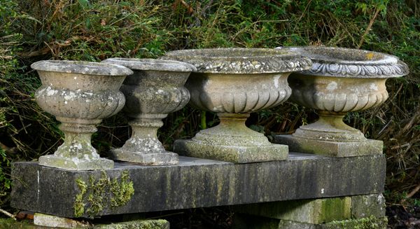Two pairs of composition stone urns 2nd half 20th century the larger 57cm diameter, together with a larger urn, 94cm high see our website for extra...
