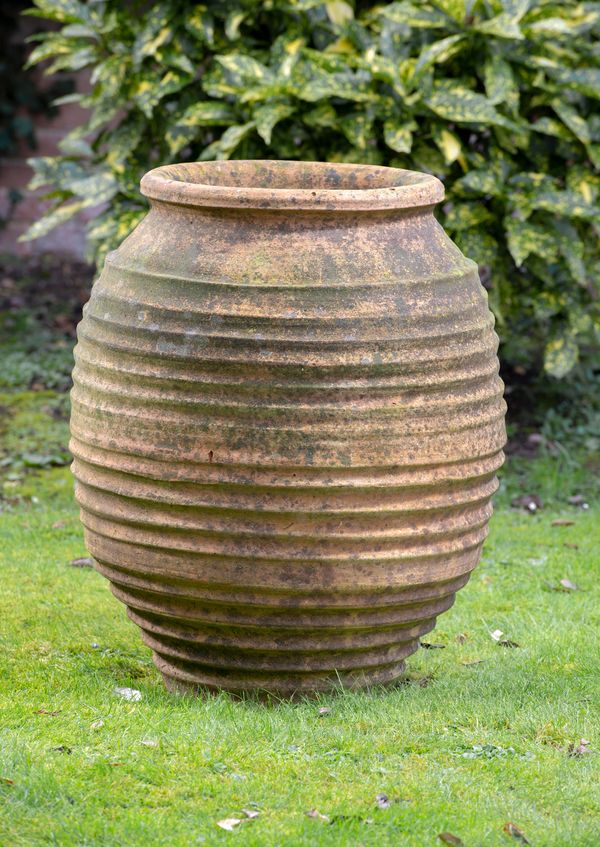 A beehive terracotta oil storage jar Southern Mediterranean, early 20th century 75cm high
