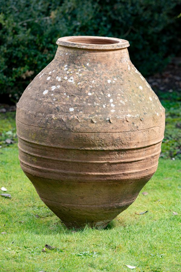 A terracotta oil storage jar Southern Mediterranean, late 19th/early 20th century 86cm high 