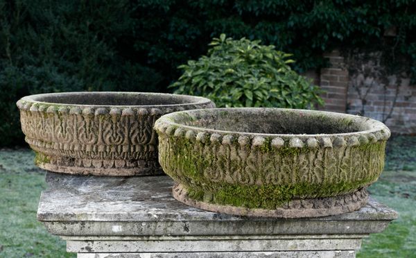 † A pair of carved sandstone shallow circular planters modern 60cm diameter