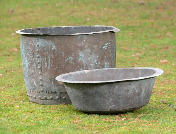 Two washing coppers 19th century the larger 54cm high by 78cm diameter, together with a pair of cast iron urns, 2nd half 19th century, 40cm diameter