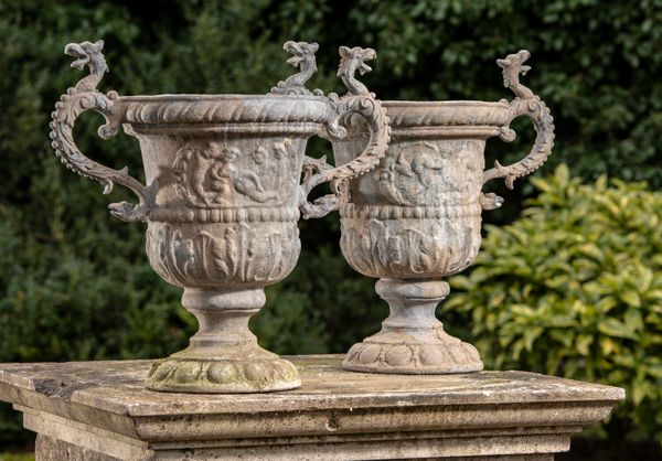 † A pair of Georgian style lead urns modern 59cm high 