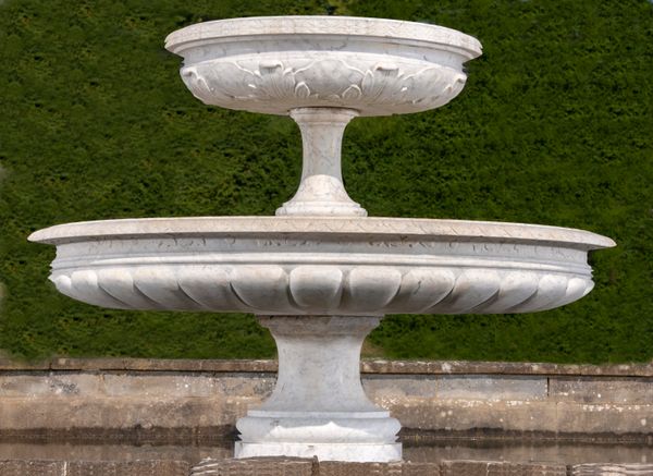 A carved white marble two tier fountain Italian, circa 1900 140cm high by 180cm diameter