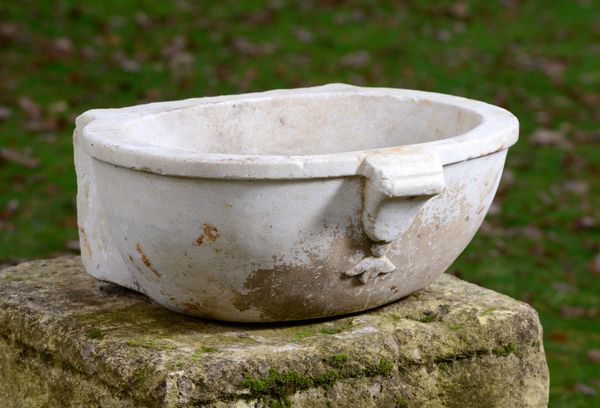 A carved white marble font Italian 17th/18th century 56cm wide