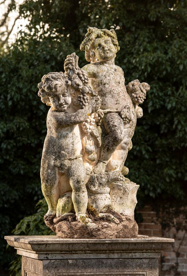 A composition stone group of two putti holding fruits 2nd half 20th century 130cm high 