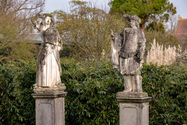 A pair of composition stone figures in medieval dress 2nd half 20th century 143cm high 