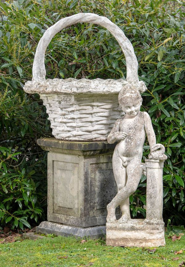 A composition stone basket planter mid 20th century 80cm high by 77cm wide, together with a composition stone figure of a boy with a duck, 95cm high