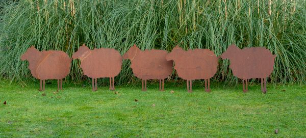 A set of five sheet metal sheep modern with lawn spikes each 52cm high by 56cm long