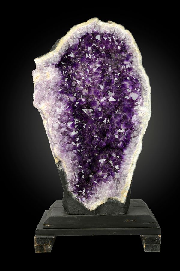 An impressive amethyst geode Brazil 122cm high on wooden stand