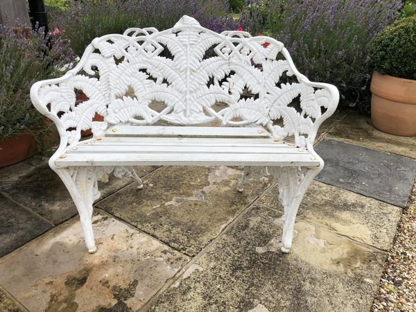 A pair of Coalbrookdale style Fern and Blackberry pattern cast iron garden seats 20th century 110cm wide From the personal collection of Tim...