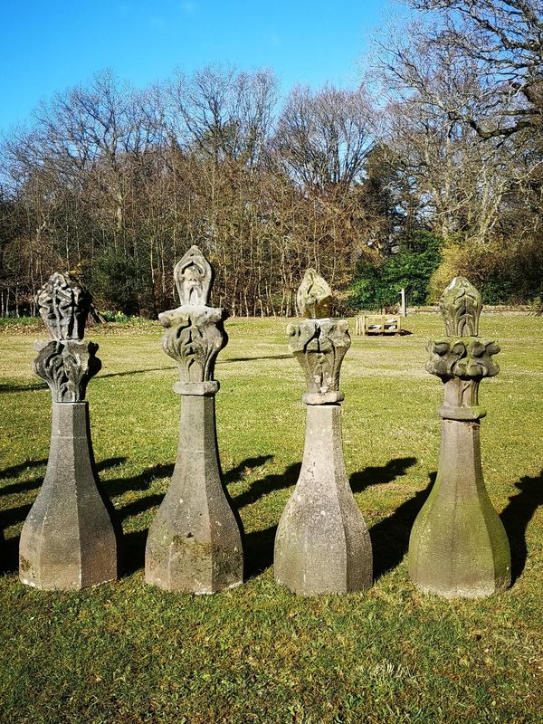 A near set of four carved stone Gothic finials 2nd quarter 19th century average height 100cm The modelling of these finials would suggest that they...