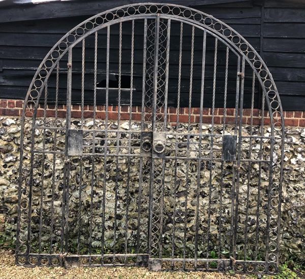 An important pair of wrought iron gates designed by Sir Edwin Lutyens and removed from The Deanery, Sonning overall height 234cm; overall width...