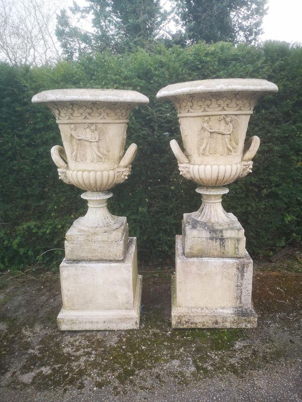 A pair of composition stone urns on pedestals last quarter 20th century 157cm high