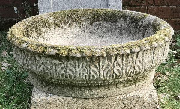 † A shallow carved sandstone bowl modern 63cm diameter