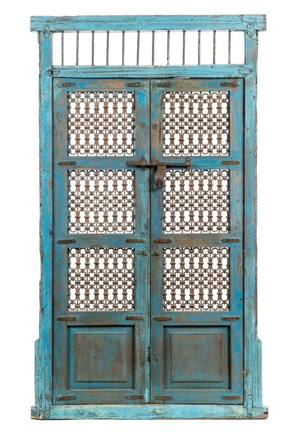 † A painted wood and wrought iron door Gujurate, India, early 20th century 203cm high by 118cm wide