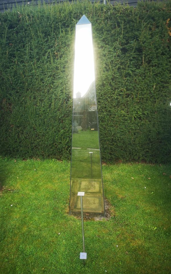 A David Harber smoked glass obelisk sundial modern inscribed with a poem and on stainless steel base originally wired with a light together with...