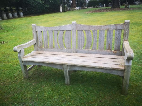 A carved hardwood seat modern 184cm wide