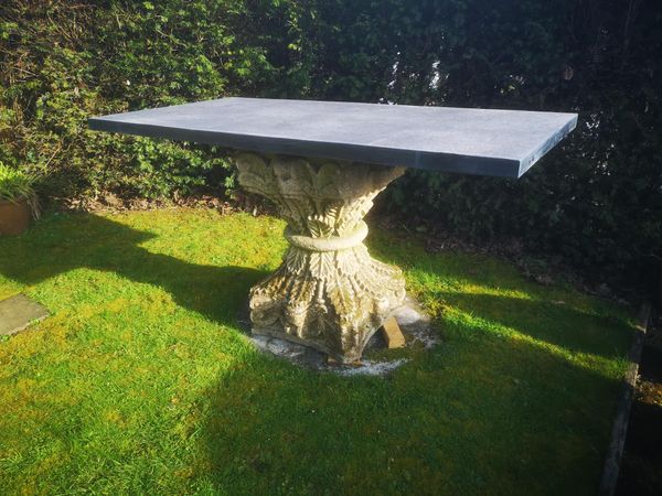 † A carved sandstone table