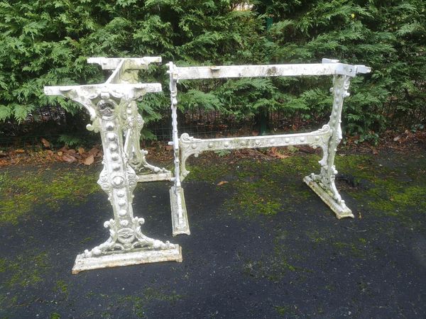 A pair of Victorian cast iron tables possibly by Coalbrookdale 2nd half 19th century (lacking marble tops) but with two later iron mesh tops 69cm...