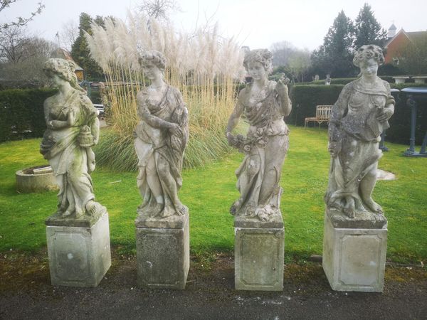 A set of four carved limestone figures representing the Seasons  2nd half 20th century on pedestals  172cm high