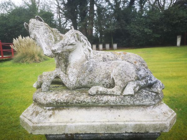 A composition stone group of mare and foal 2nd half 20th century 50cm high by 70cm long