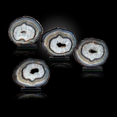 A set of four graduated Agate slices on stands ***TWO BROKEN - NEEDS NEW PHOTO***