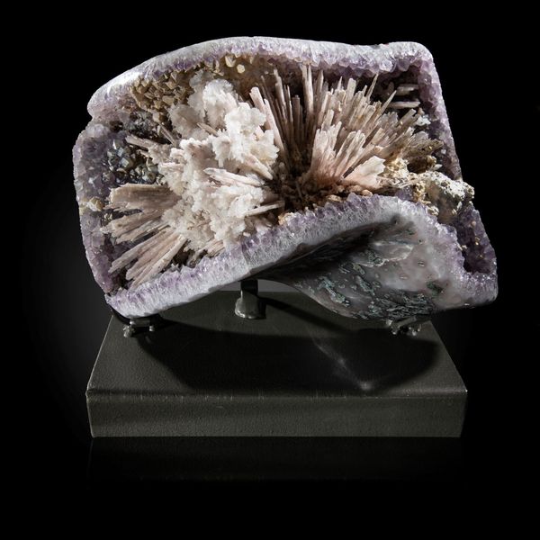 An impressive amethyst and calcite specimen Brazil on metal stand 34cm wide