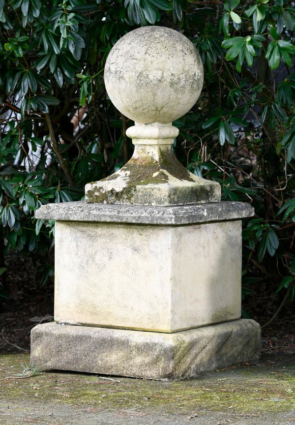 A composition stone gate pier ball on pedestal 153cm high